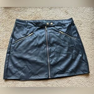 Black leather-like shirt. Brand new never been worn. Size 14.